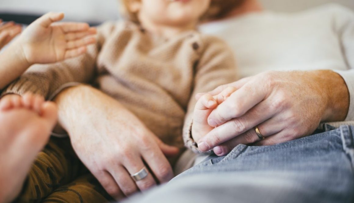 man-with-young-kids-resting